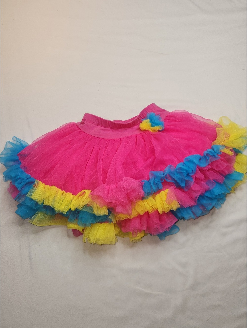 Girls pink tutu skirt with rainbow ruffle trim